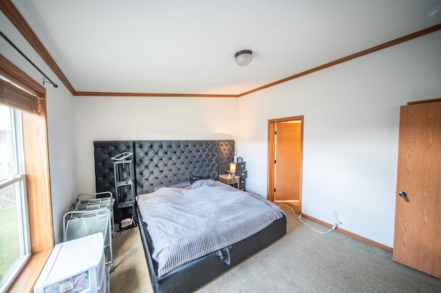 bedroom with carpet flooring and crown molding