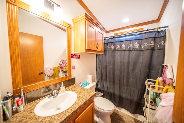 bathroom with toilet, ornamental molding, and vanity