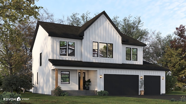 modern farmhouse with a front yard and a garage