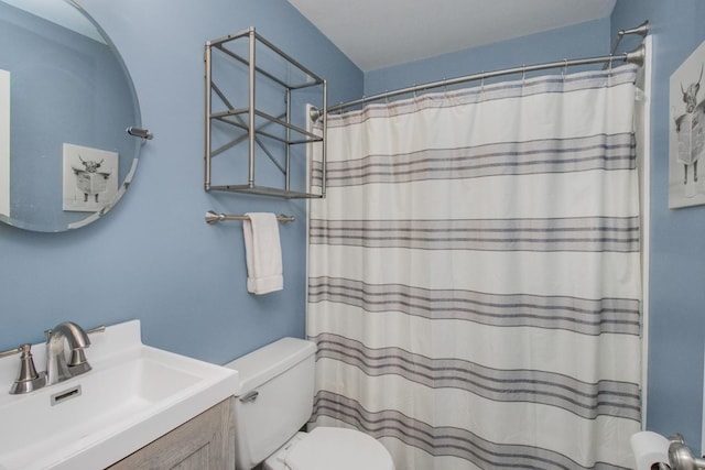 bathroom with a shower with curtain, vanity, and toilet