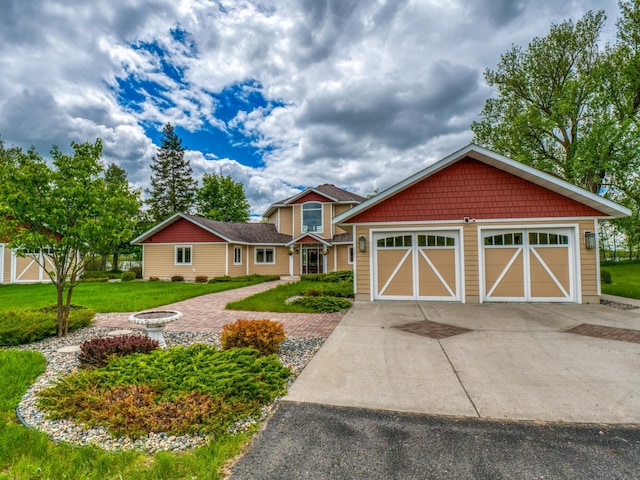 view of front of property featuring a garage and a front lawn