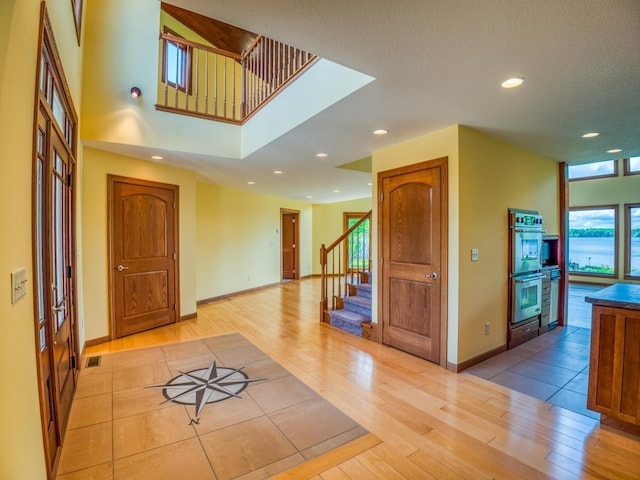 entrance foyer with light hardwood / wood-style floors