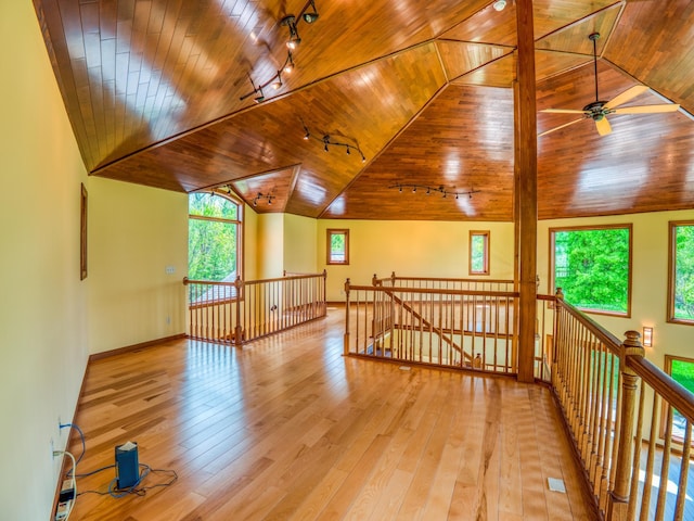 additional living space featuring ceiling fan, wooden ceiling, vaulted ceiling, and light wood-type flooring