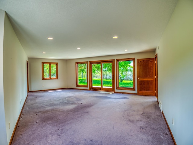 empty room with light colored carpet