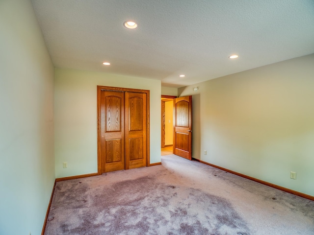 unfurnished bedroom with light carpet