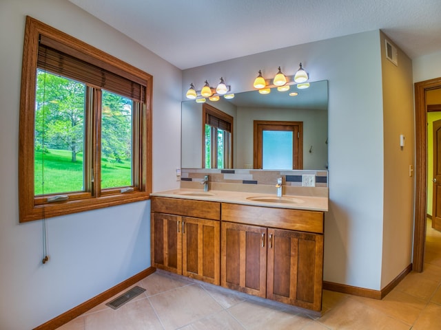 bathroom featuring tile patterned floors and vanity