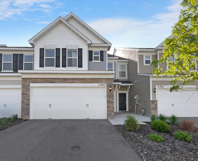 townhome / multi-family property featuring a garage