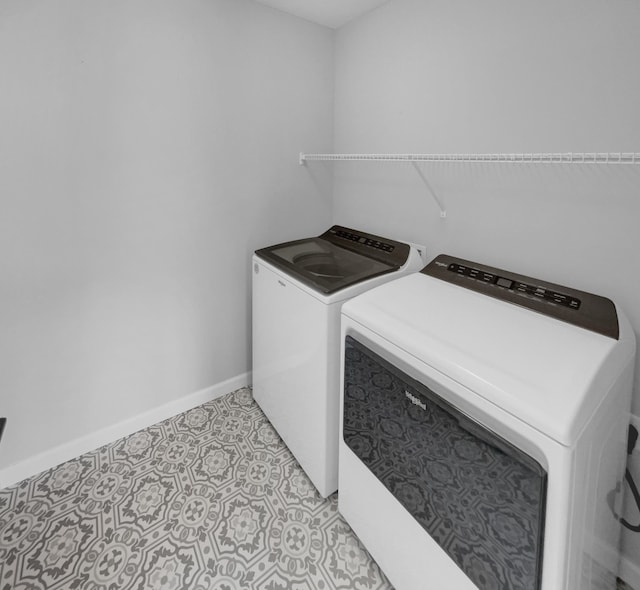 washroom with separate washer and dryer