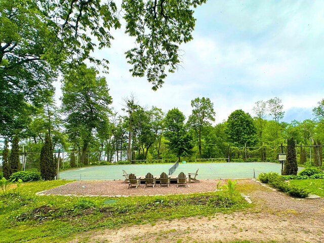 2799DOUGLAS 27th St Unit 9, Douglas Cabin, Birchwood, WI 54817 - view of yard featuring a tennis court and fence