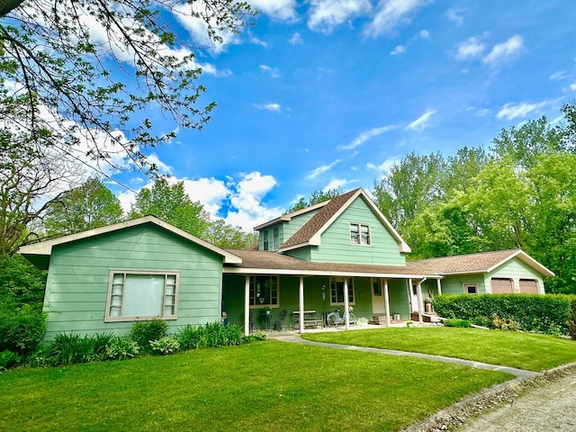 view of front of home with a front yard and covered porch