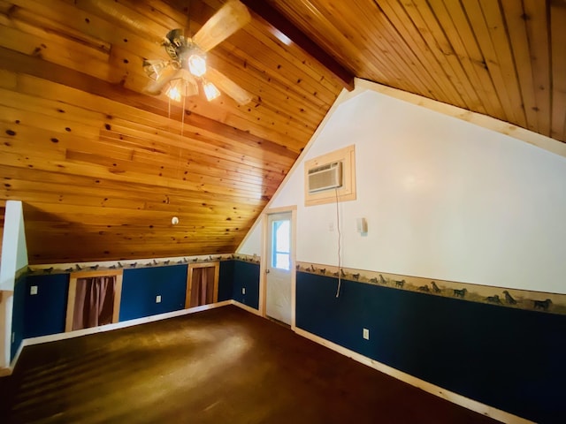 additional living space with vaulted ceiling with beams, wood ceiling, a wall mounted AC, and ceiling fan