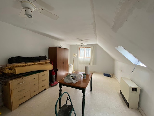 bonus room featuring vaulted ceiling with skylight and ceiling fan