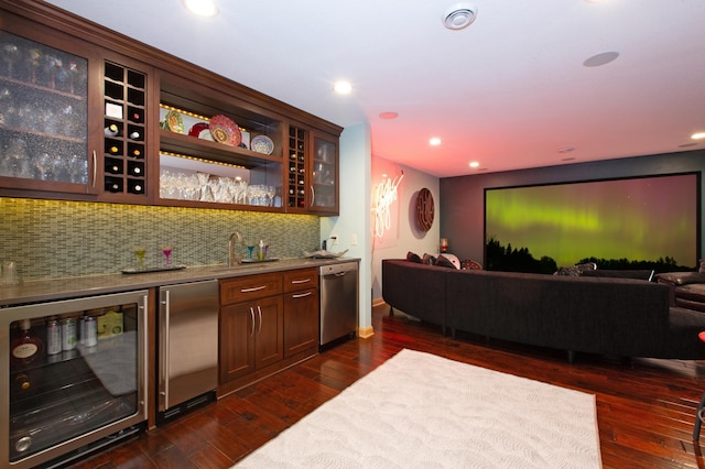 bar with beverage cooler, dark hardwood / wood-style flooring, decorative backsplash, fridge, and stainless steel dishwasher