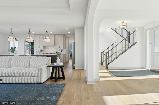 living room with light hardwood / wood-style floors