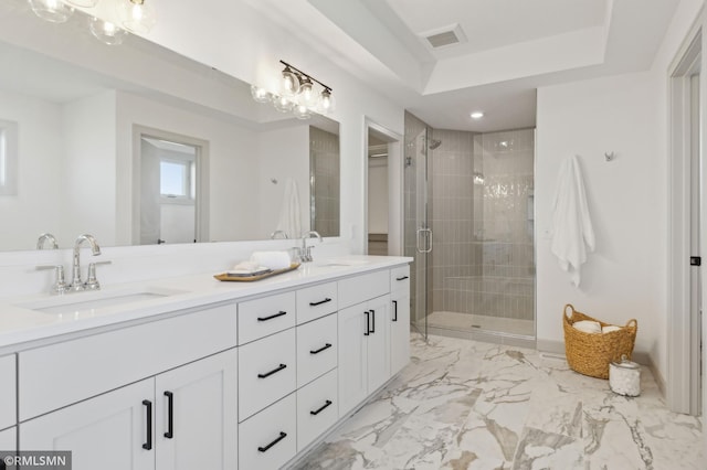 bathroom featuring vanity and an enclosed shower