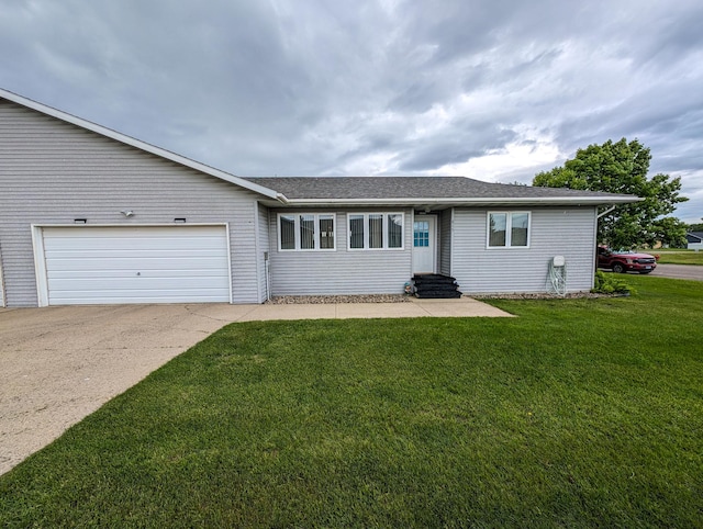 single story home with an attached garage, driveway, a front lawn, and entry steps