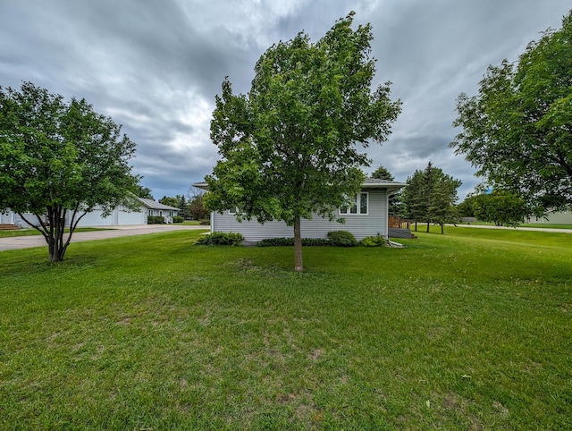 view of yard featuring a garage