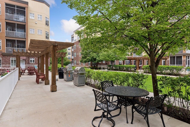 view of patio with a pergola and area for grilling