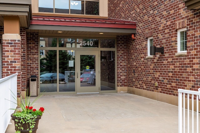 doorway to property with a patio area