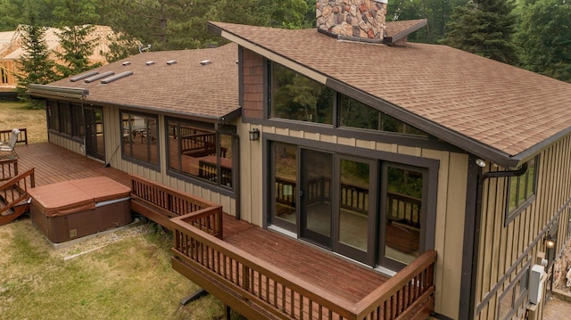 rear view of house featuring a deck