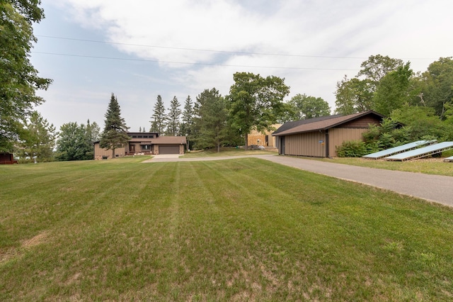 view of front facade with a garage and a front lawn