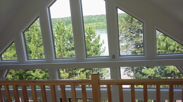 interior space with a water view and a healthy amount of sunlight