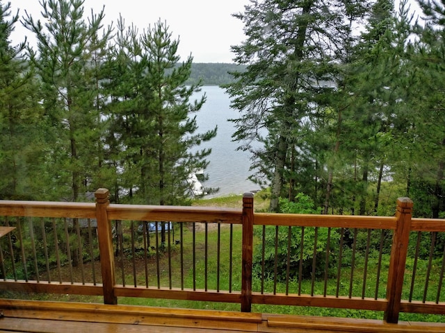 wooden deck featuring a water view