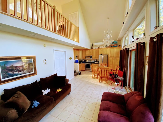 living room with a notable chandelier, high vaulted ceiling, and light tile patterned floors