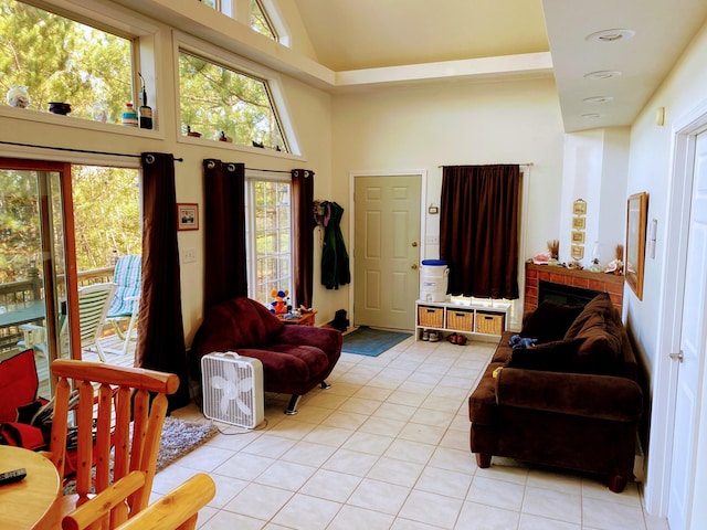 living area featuring recessed lighting, light tile patterned floors, and high vaulted ceiling