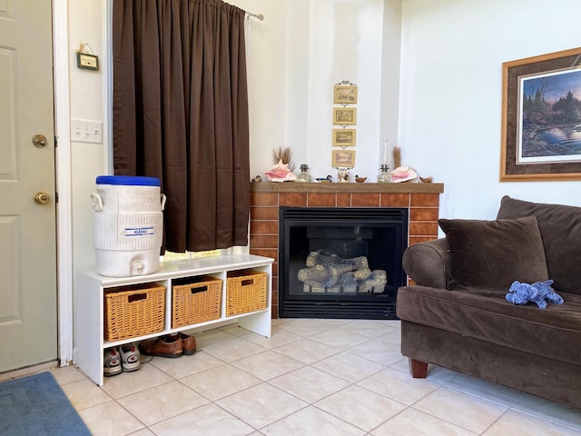 sitting room with light tile patterned floors and a fireplace