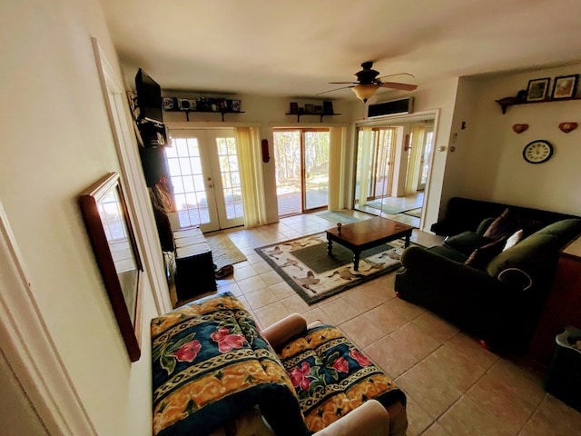 living room featuring ceiling fan, french doors, and light tile patterned floors