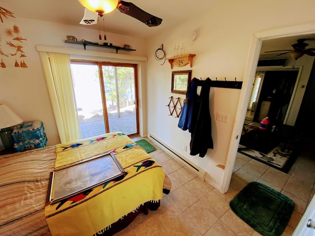 bedroom with baseboards, tile patterned floors, a baseboard radiator, ceiling fan, and access to outside