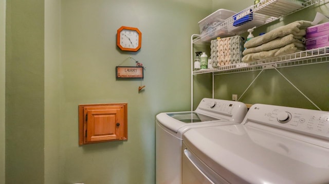 washroom with washing machine and dryer