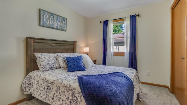 bedroom featuring light carpet