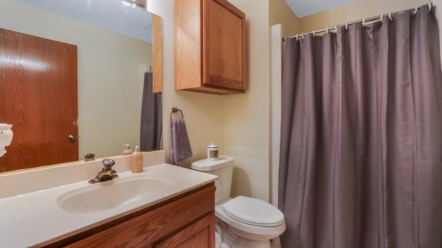 bathroom with toilet and vanity