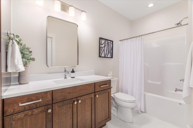 full bathroom with vanity, tile patterned floors, shower / bath combo, and toilet