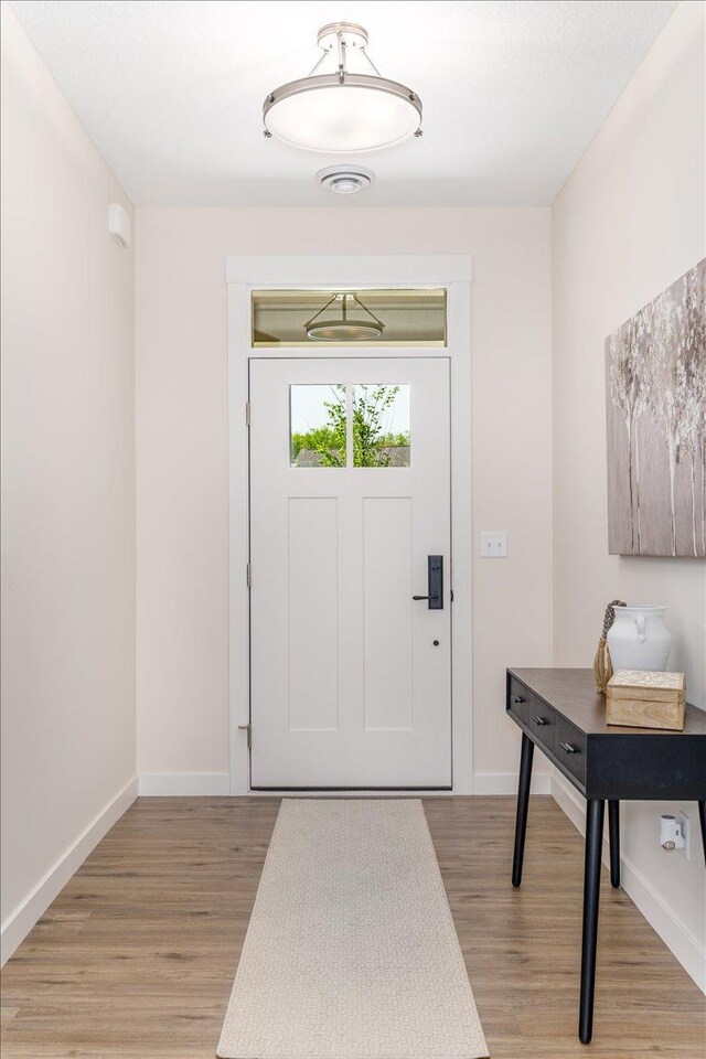 doorway to outside featuring light hardwood / wood-style floors