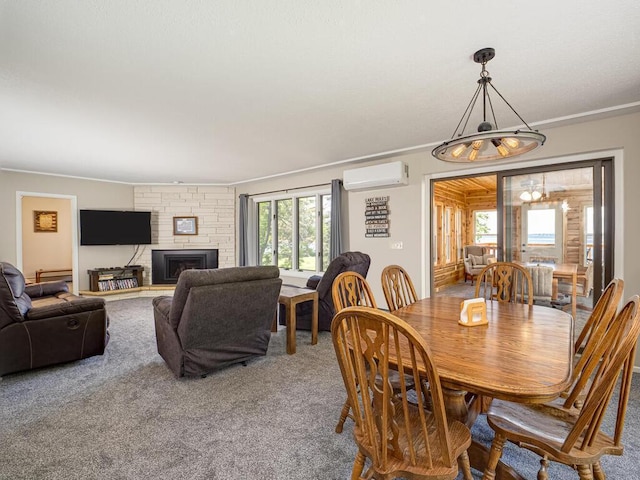 dining room featuring a wall mounted air conditioner, ornamental molding, healthy amount of natural light, and carpet flooring