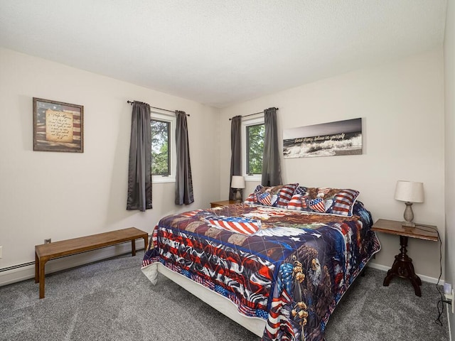 carpeted bedroom featuring baseboards