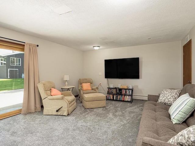 carpeted living area featuring baseboard heating and a textured ceiling