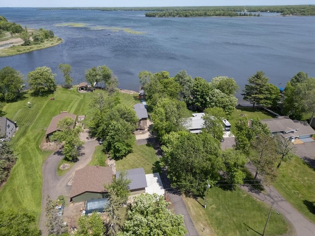 aerial view of property and surrounding area featuring a nearby body of water