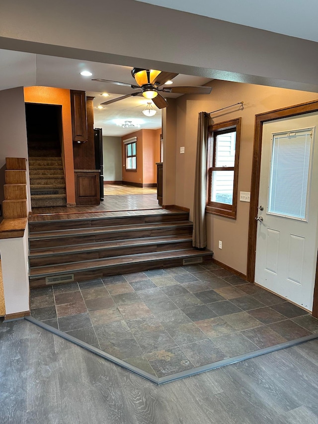 foyer featuring ceiling fan