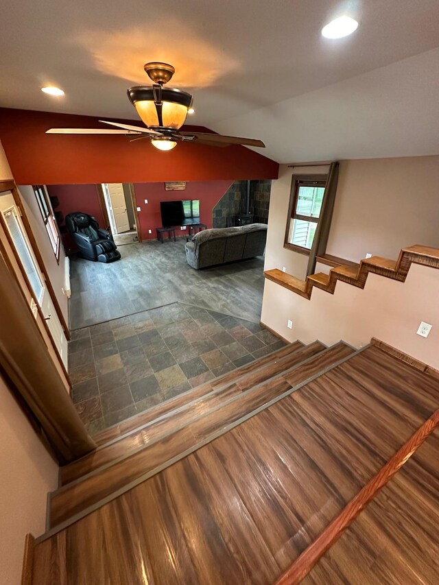 interior space with lofted ceiling, ceiling fan, and hardwood / wood-style floors