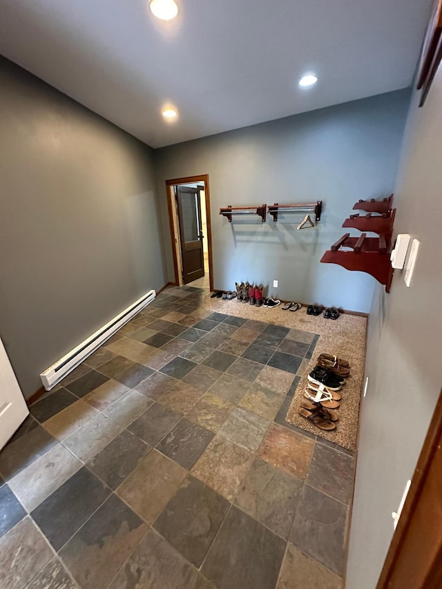 921 11th St N, Mountain Lake, MN 56159 - interior space featuring recessed lighting, stone tile flooring, and a baseboard heating unit