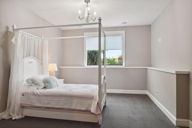 bedroom with carpet floors and a notable chandelier