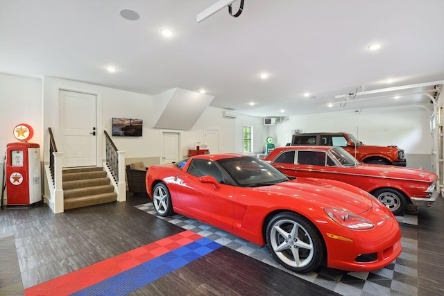 garage featuring a wall unit AC