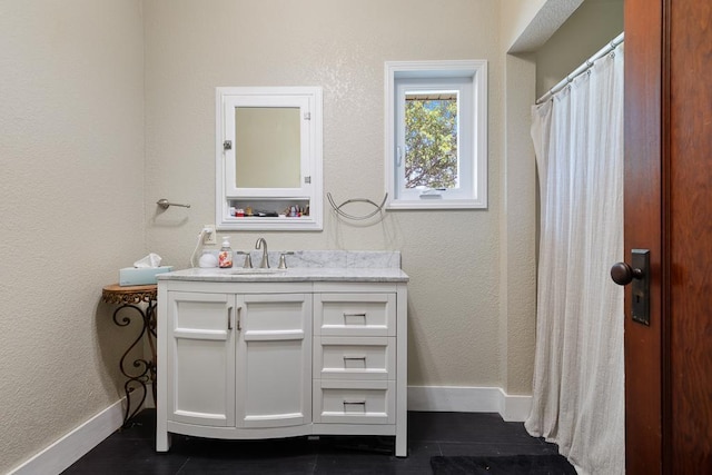 bathroom featuring tile patterned floors and vanity