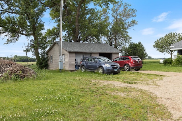 view of side of property with a yard