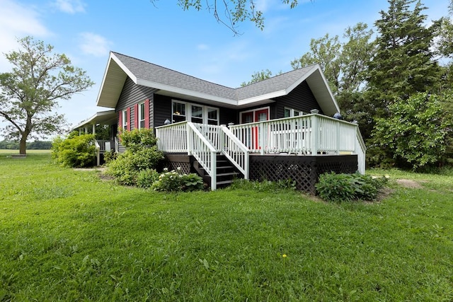 exterior space featuring a wooden deck and a yard