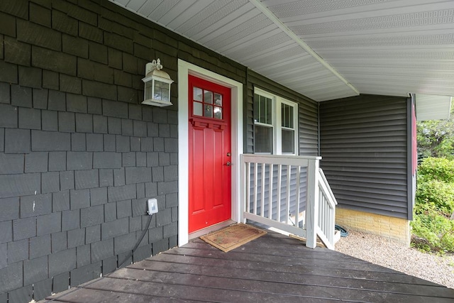 doorway to property featuring covered porch